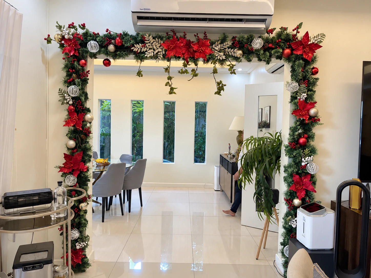 Red and silver Christmas garland around a doorway